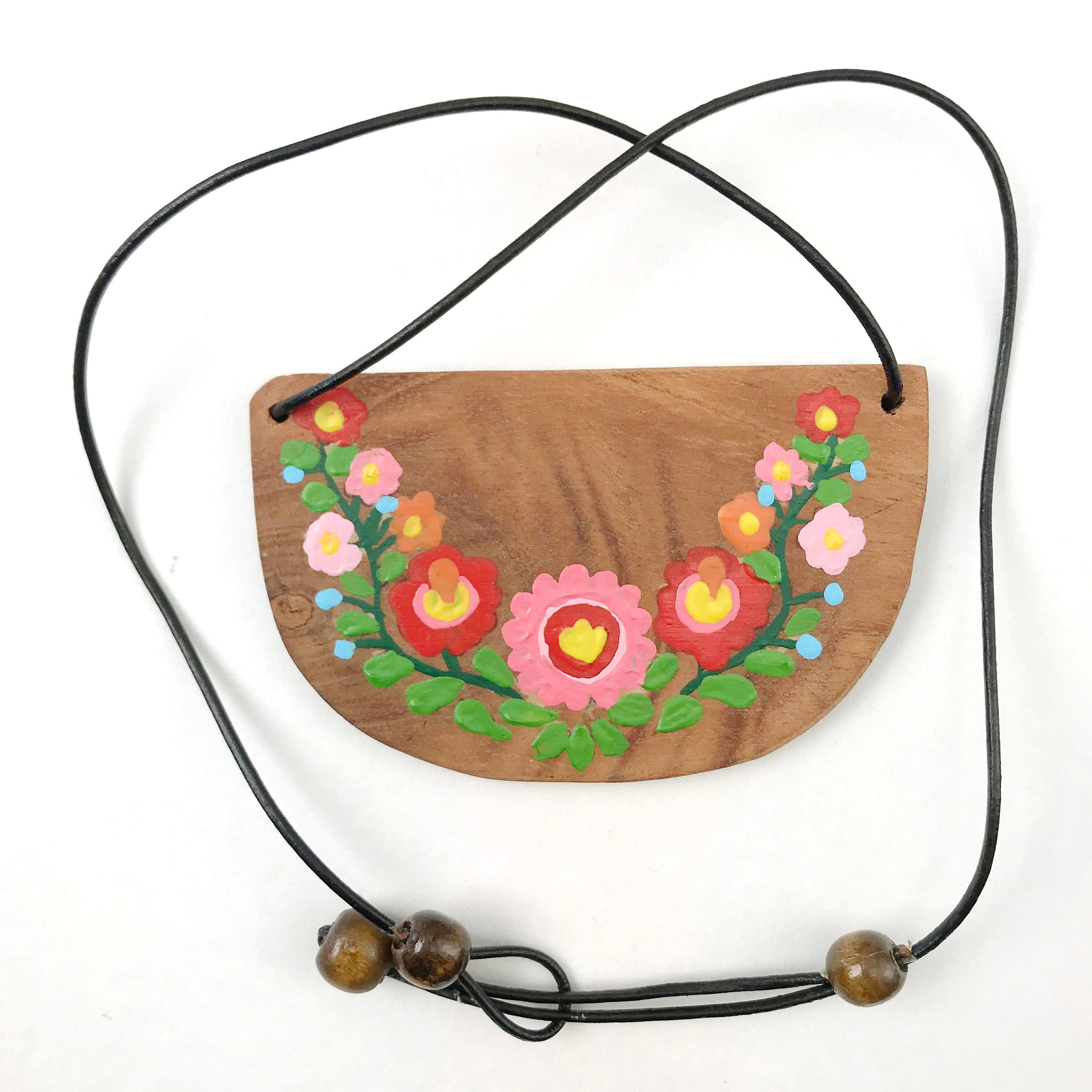 Fine art painting flowers over wood pendant in hippie boho style. Wooden hand painted necklace with flowers.